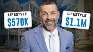 Man smiling with townhomes in the background.