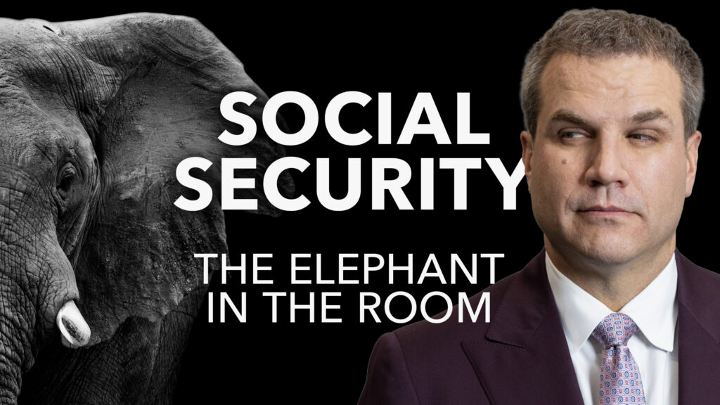 Man standing next to an elephant with the words, "Social Security The Elephant in the Room."