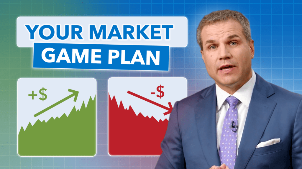 man standing in front of two market charts looking serious.