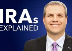 Man in suit and tie smiling with the words "IRAs Explained"